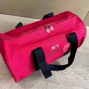 CHANEL No.1 Novelty Red Canvas
Duffle Bag with Black Straps